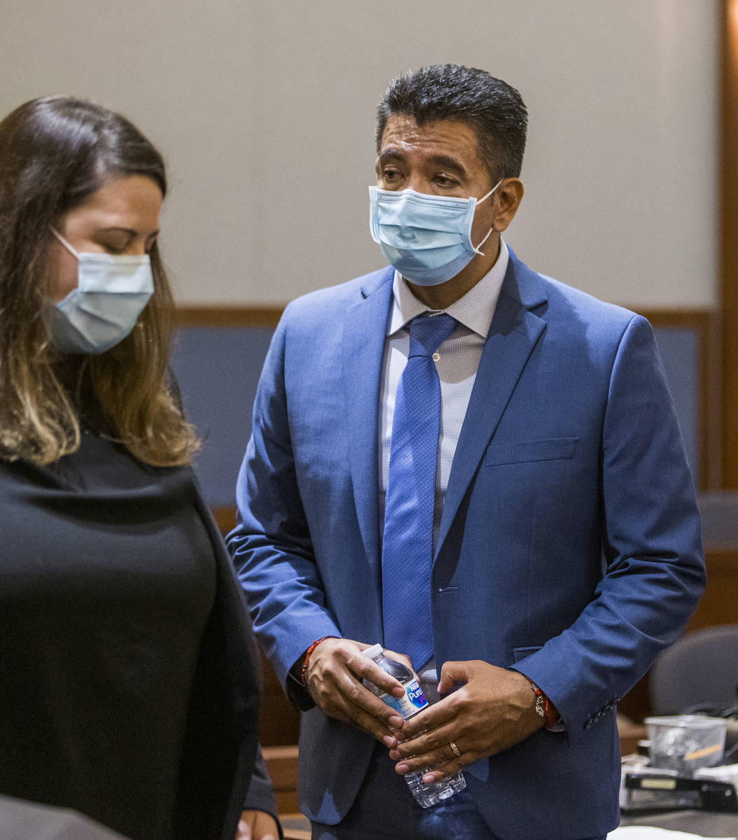 Defendant Adolfo Orozco leaves the courtroom with an attorney during a preliminary hearing in t ...