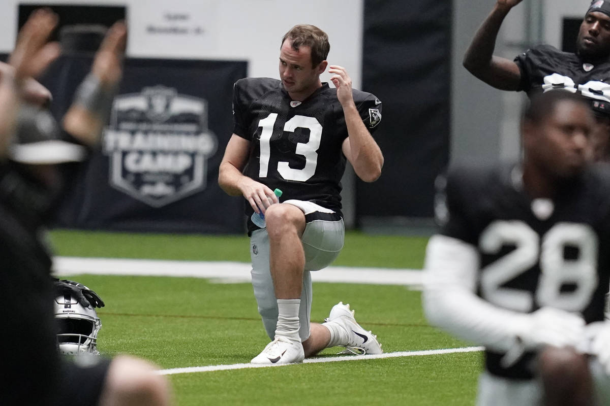 Las Vegas Raiders wide receiver Hunter Renfrow (13) stretches during an NFL football training c ...