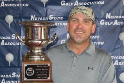 Joe Peroglio holds the championship trophy after winning the Nevada State Senior Amateur at Red ...