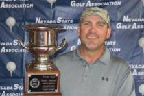 Joe Peroglio holds the championship trophy after winning the Nevada State Senior Amateur at Red ...