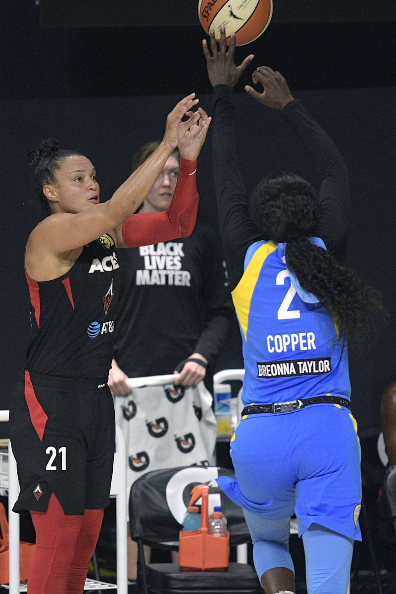 Las Vegas Aces guard Kayla McBride (21) goes up for a shot in front of Chicago Sky guard Kahlea ...