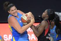 Chicago Sky center Stefanie Dolson, left, gains control of a rebound with Las Vegas Aces guard ...