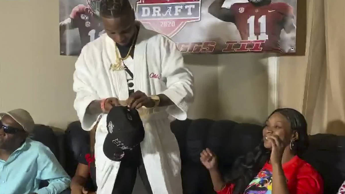 In this still image from video provided by the NFL, Henry Ruggs III gets ready to put on a Las ...