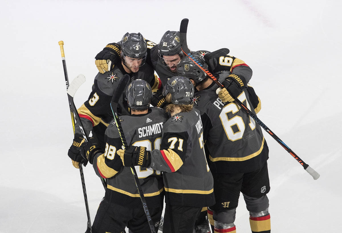 Vegas Golden Knights celebrate a goal against the Chicago Blackhawks during the first period of ...