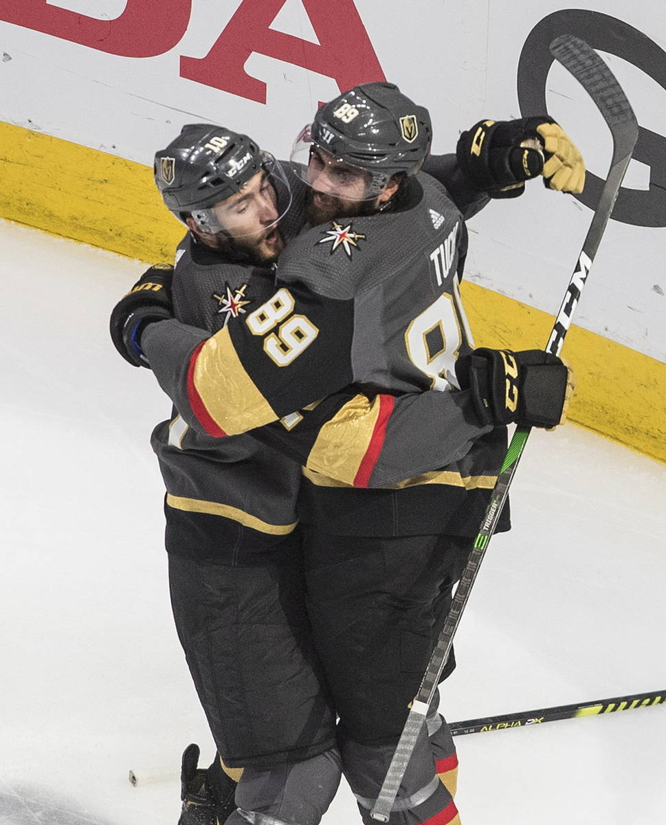 Vegas Golden Knights' Nicolas Roy (10) and Alex Tuch (89) celebrate a goal against the Chicago ...