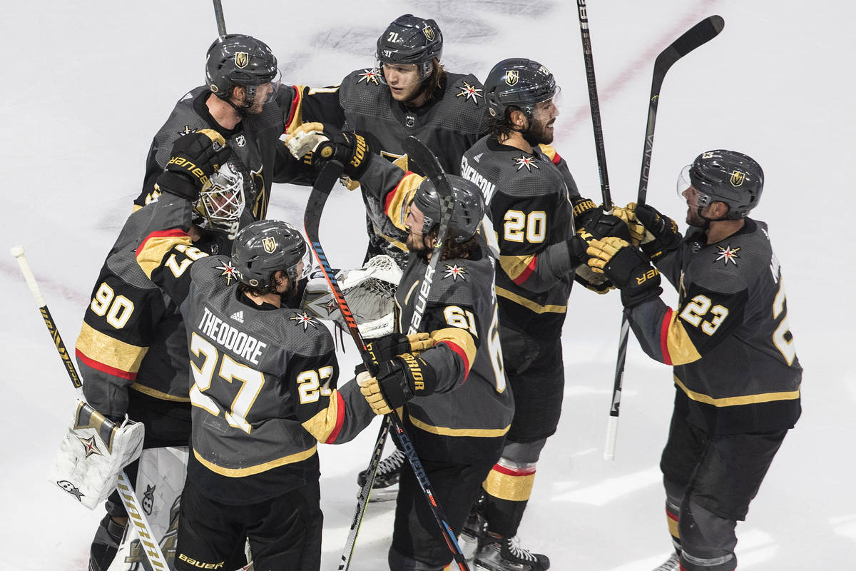 The Vegas Golden Knights celebrate a win over the Chicago Blackhawks in Game 5 of an NHL hockey ...