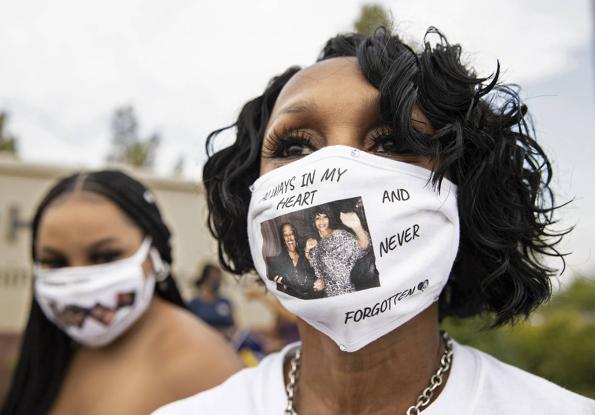 Anaya Ducree, right, wears a mask honoring Dignity Health St. Rose Dominican worker Yulanda Hod ...