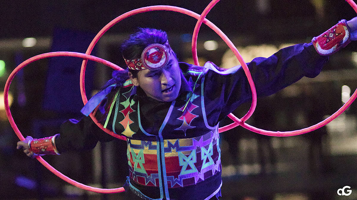 In this Aug. 10, 2018, photo provided by Anderson Gould Jr. hoop dancer Nakotah LaRance perform ...