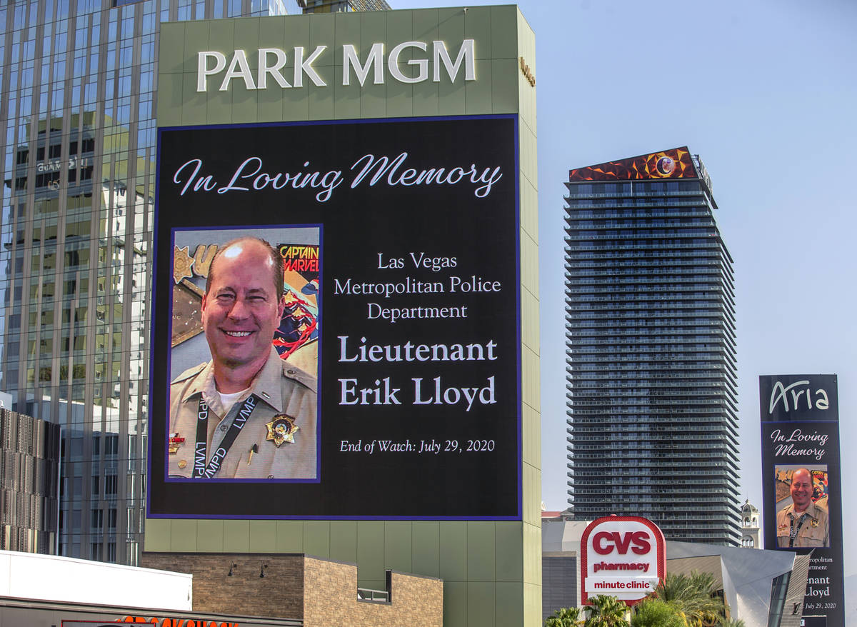 The marquee at Park MGM recognizes the passing of Metro Lt. Erik Lloyd as his funeral processio ...