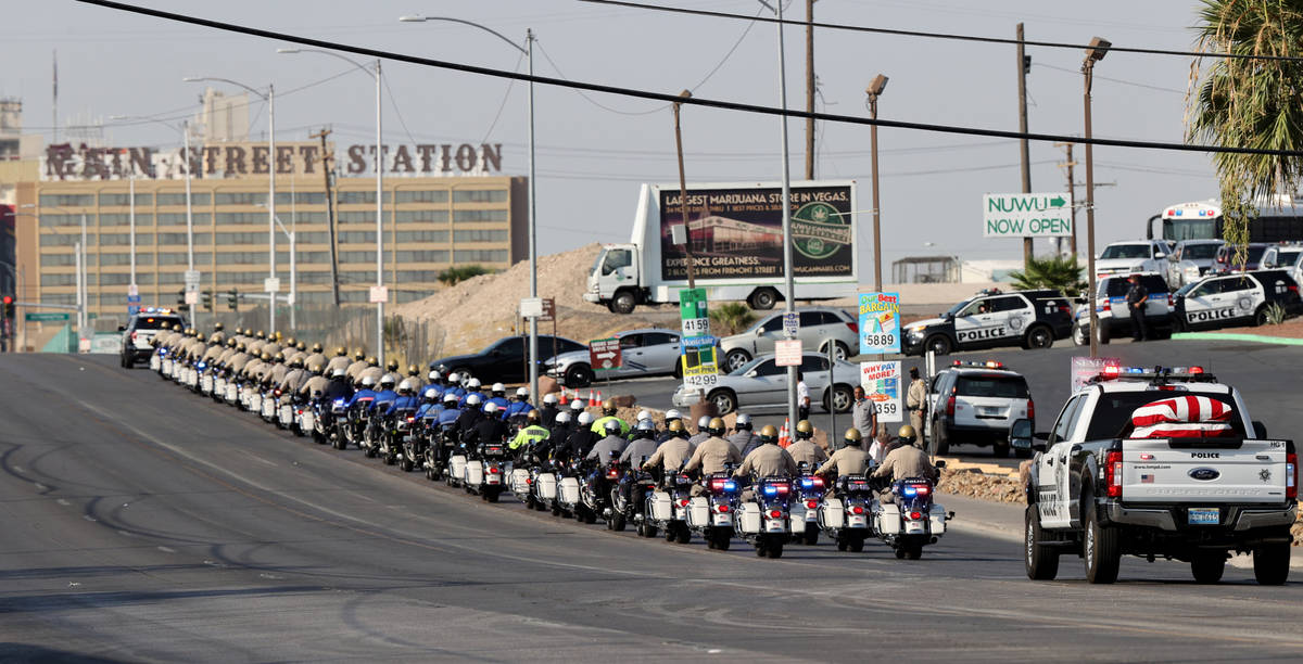 The casket for Metropolitan Police Department Lt. Erik Lloyd leaves Palm Downtown Mortuary & Ce ...