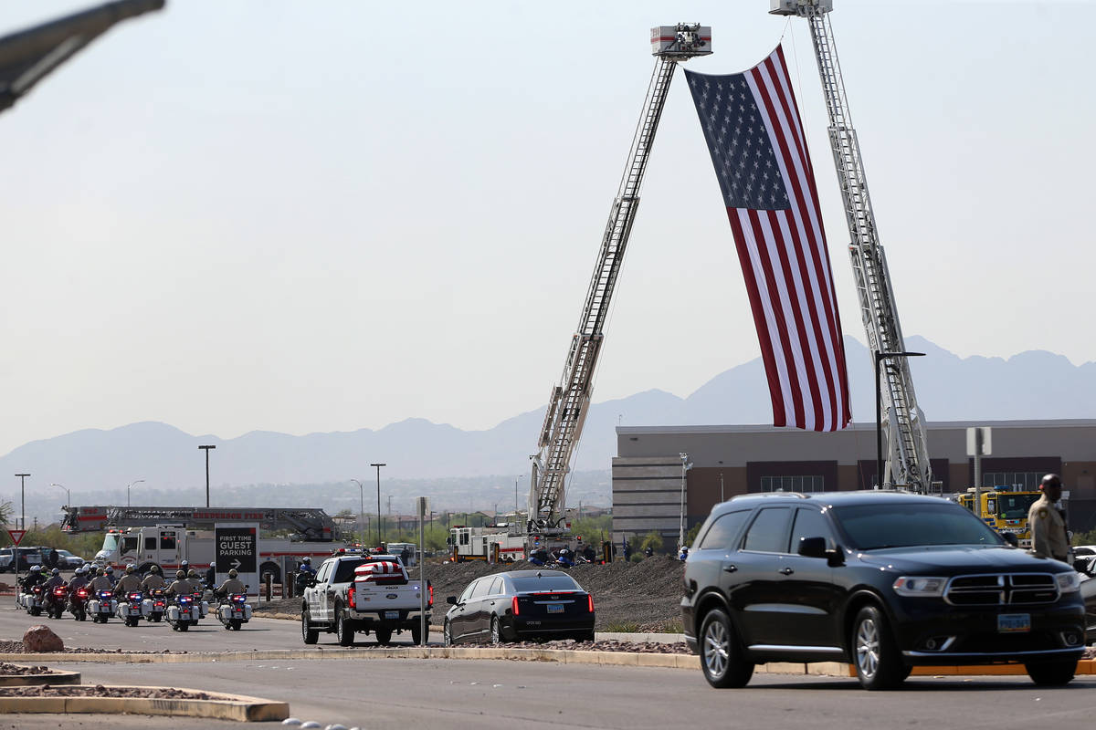 The funeral procession for Lt. Erik Lloyd arrives to Central Christian Church in Henderson, Wed ...