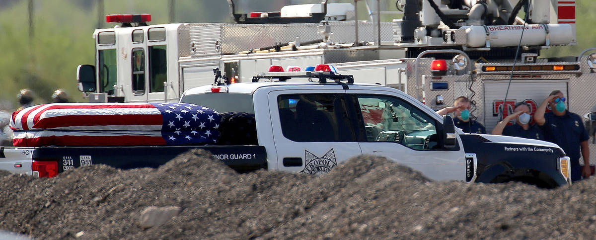 The funeral procession for Lt. Erik Lloyd arrives to Central Christian Church in Henderson, Wed ...