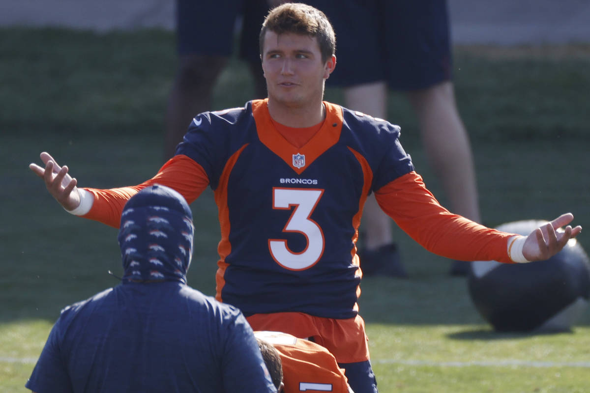 Denver Broncos quarterback Drew Lock (3) takes part in drills during an NFL football practice a ...