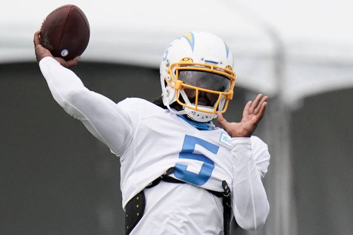 Los Angeles Chargers quarterback Tyrod Taylor throws a pass during an NFL football camp practic ...