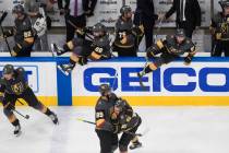 The Vegas Golden Knights celebrate a win over the Chicago Blackhawks during Game 5 of an NHL ho ...
