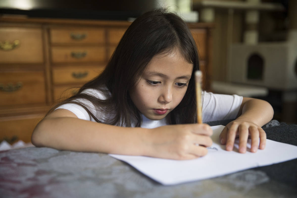 Sofia Hall, 8, draws at her home in Las Vegas, Wednesday, Aug. 19, 2020. Hall is the Nevada win ...