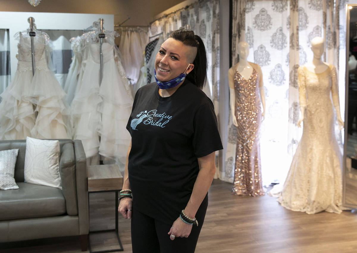 Veronica Markowsky, co- owner of Creative Bridal Wear, poses for a photo at her store on Friday ...
