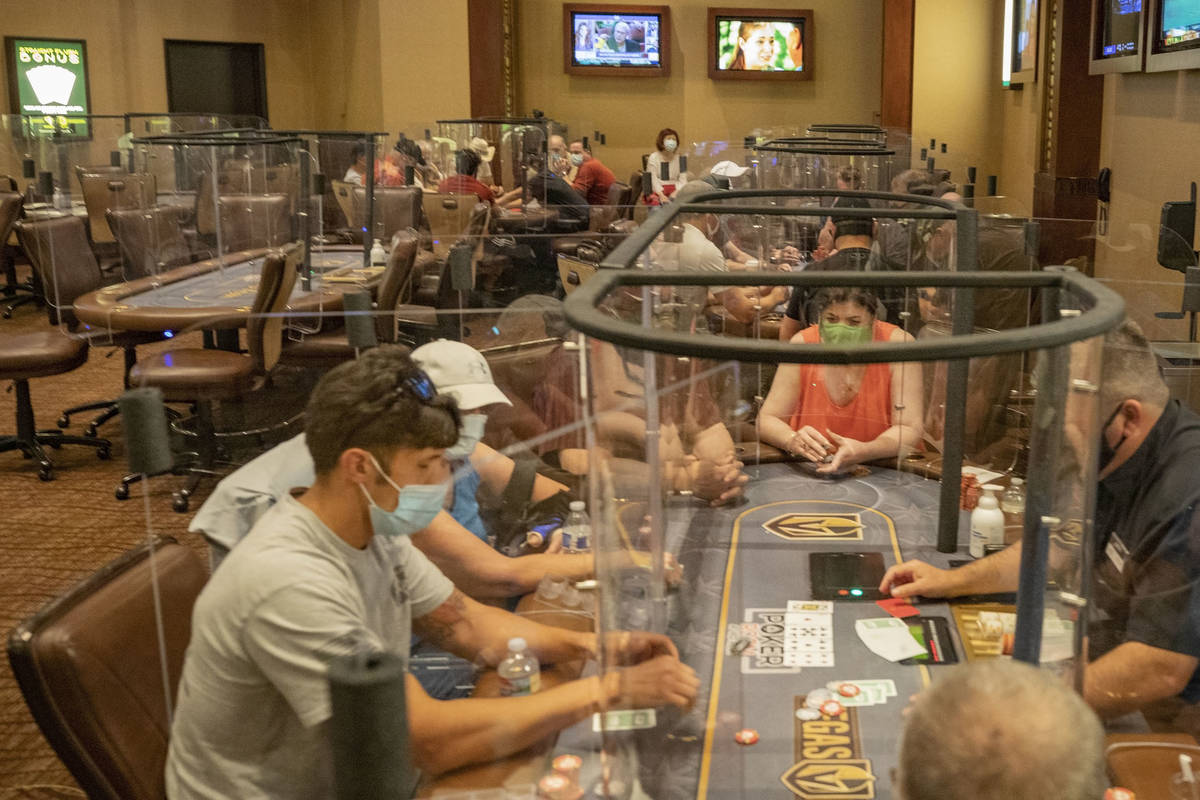 In this Aug. 3, 2020, file photo, Individuals play eight-handed poker games using plexiglass di ...