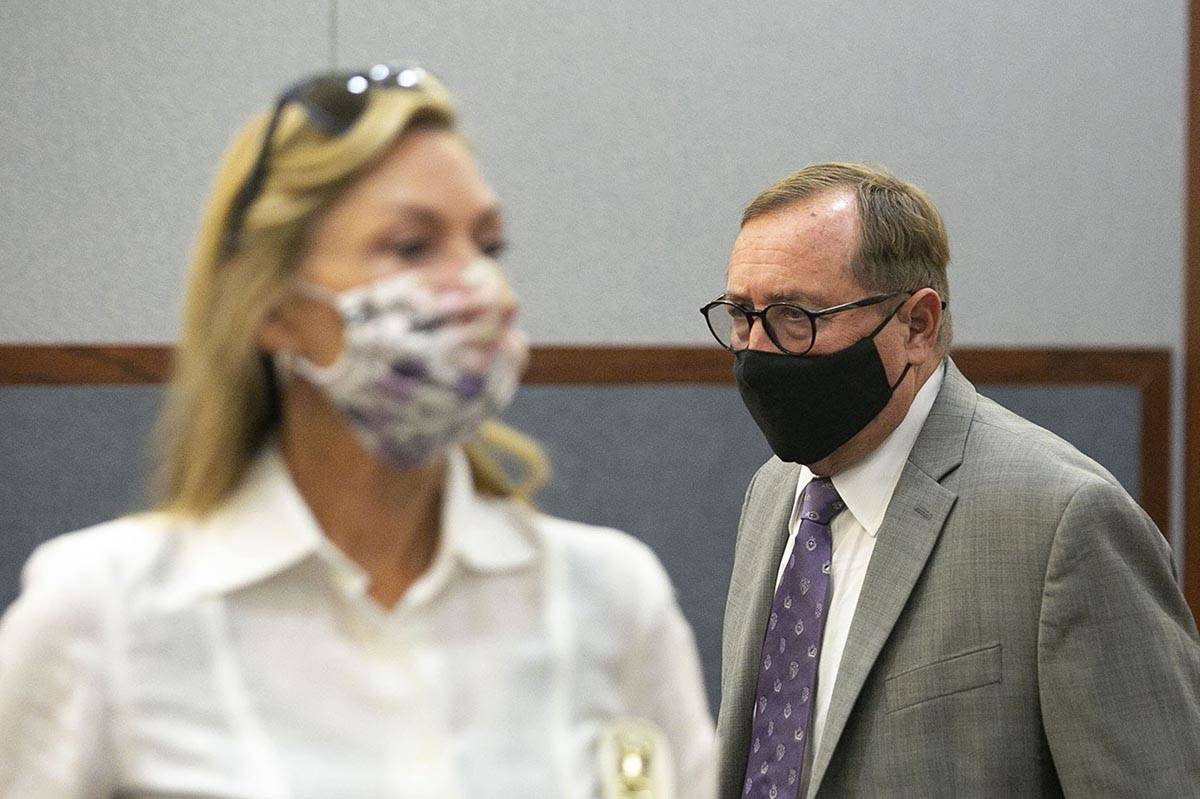 Las Vegas Convention and Visitors Authority CEO Rossi Ralenkotter, right, enters the courtroom ...