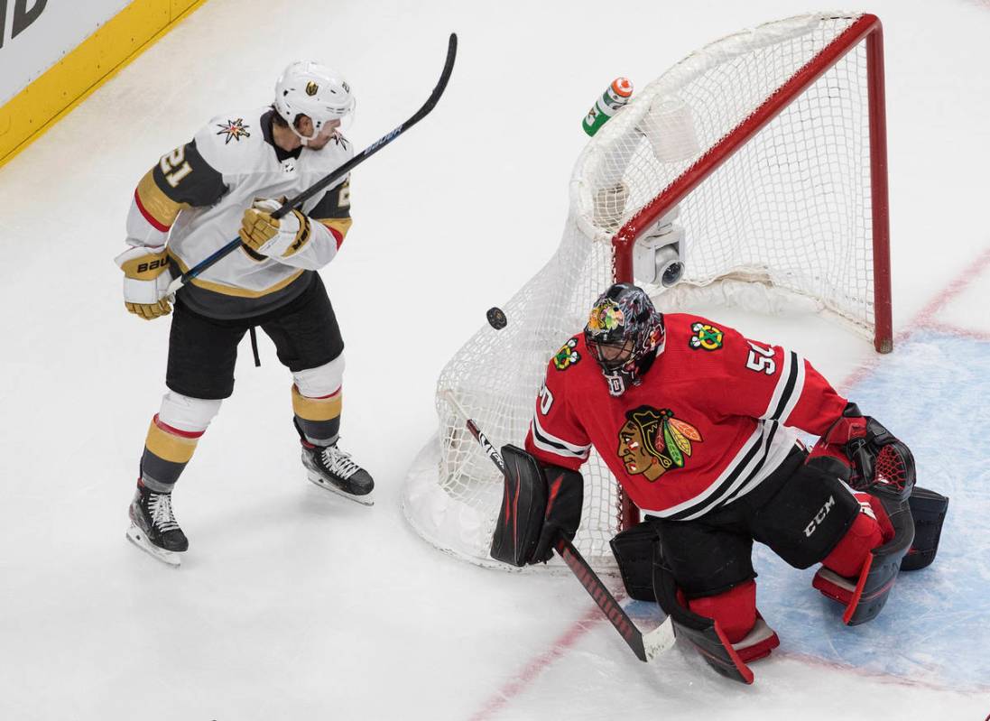 Vegas Golden Knights' Nick Cousins (21) is stopped by Chicago Blackhawks goalie Corey Crawford ...