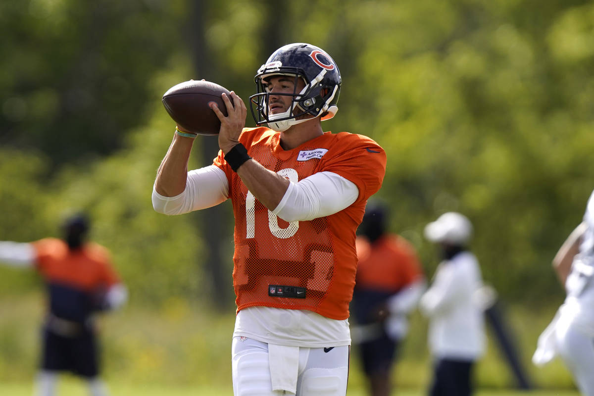Chicago Bears quarterback Mitchell Trubisky looks at a ball during an NFL football camp practic ...