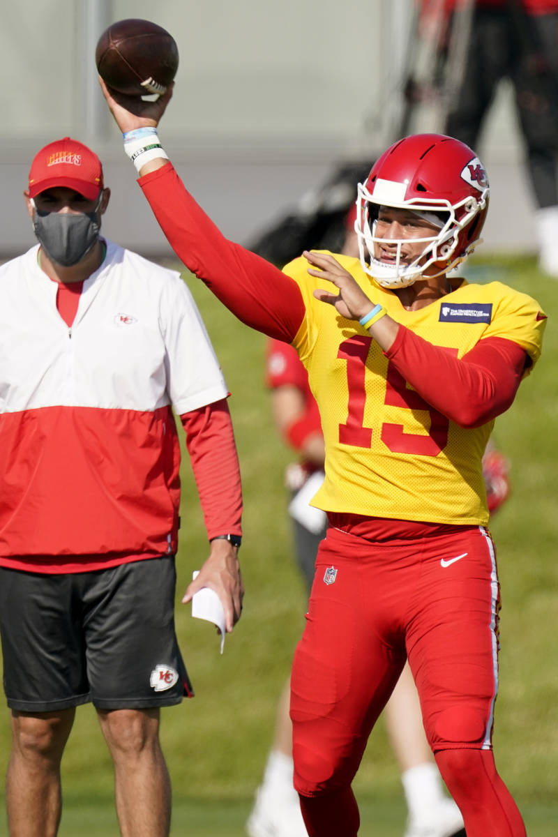 Kansas City Chiefs quarterback Patrick Mahomes throws during an NFL football training camp Frid ...