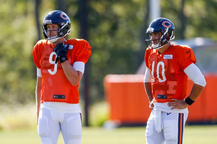 Chicago Bears quarterback Nick Foles (9) and Chicago Bears quarterback Mitch Trubisky (10) atte ...