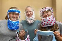 Shannon O'Toole (center) and daughters Tierney and Sage Morton model the ShanShiled face coveri ...