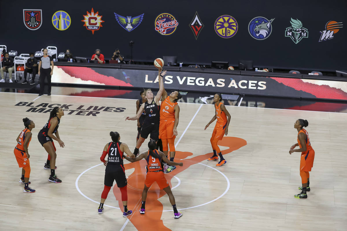 The Connecticut Sun and the Las Vegas Aces go for the tipoff during the first half of a WNBA ba ...