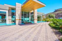 The MacDonald Highlands home measures 7,928 square feet with four bedrooms, six bathrooms and a ...