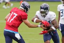 Tennessee Titans quarterback Ryan Tannehill (17) hands off to running back Derrick Henry during ...