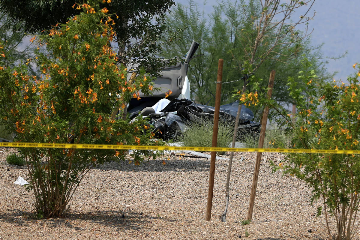 The scene of a single-vehicle crash near Alta Drive and Sky Vista Drive in Las Vegas, Friday, A ...