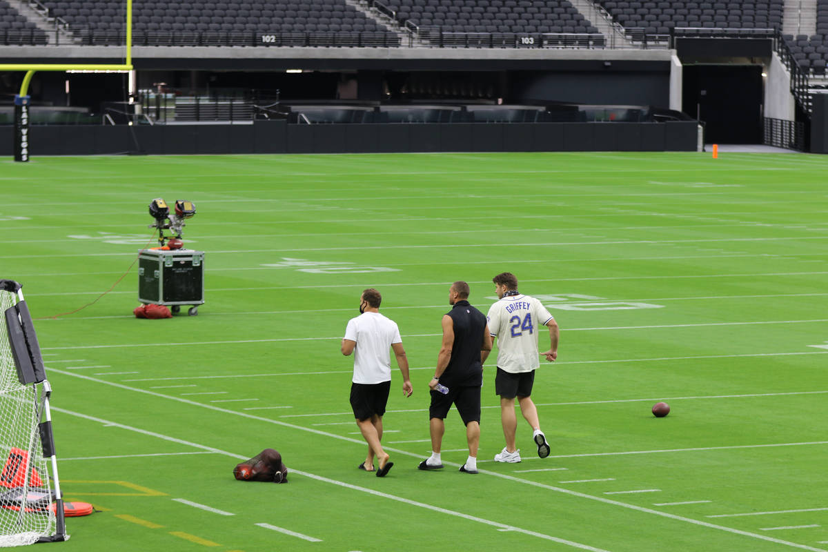 Las Vegas Raiders, from left, Alec Ingold, Derek Carrier and Foster Moreau walk on the field pr ...