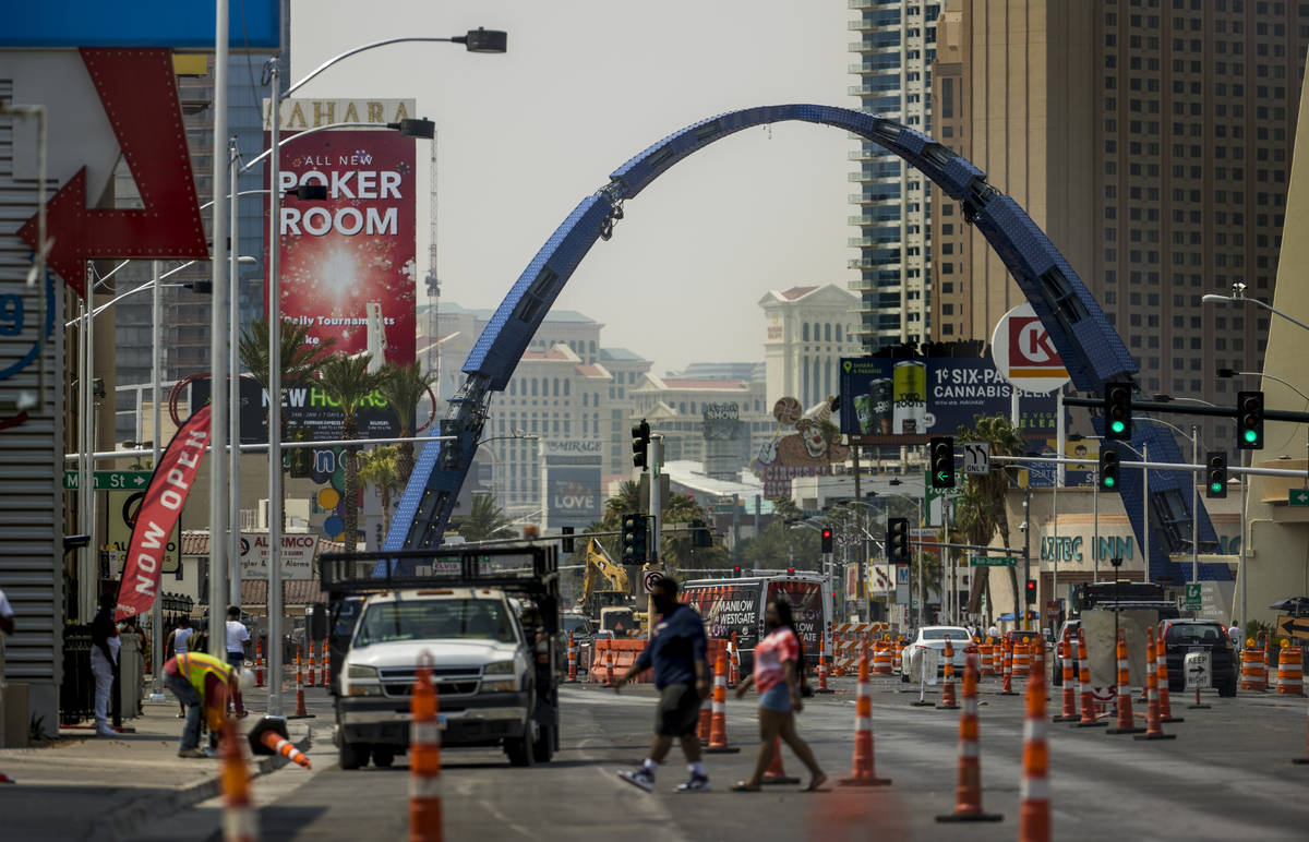 The street is in transition as construction continues of the 80-foot-tall gateway arch over Las ...