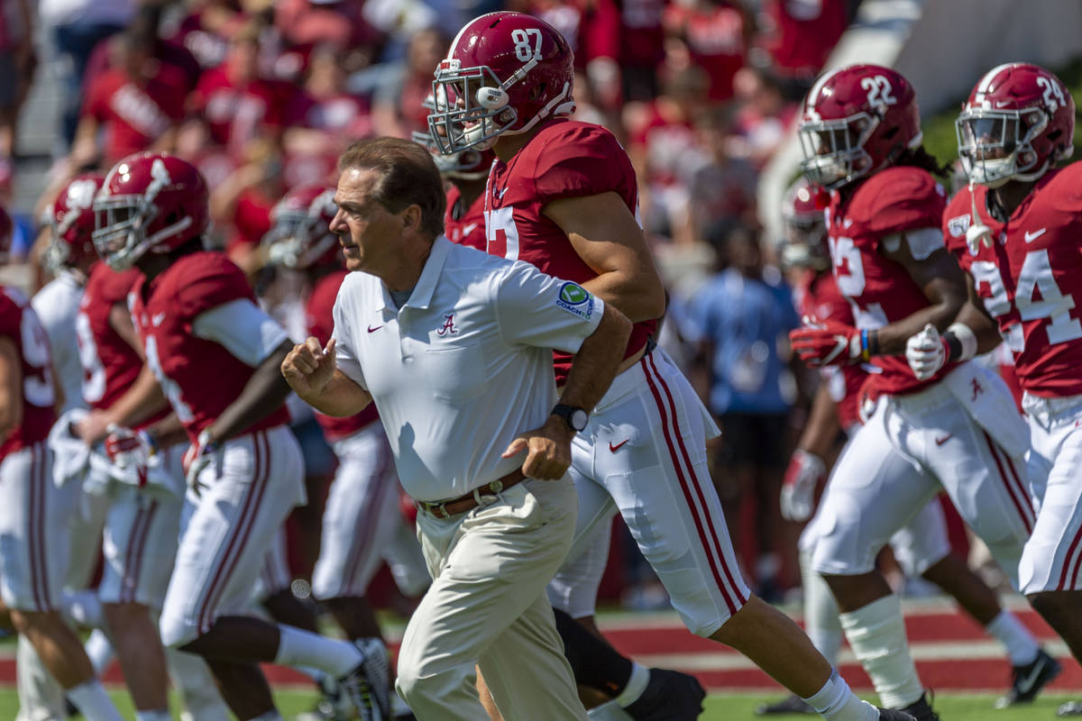 FILE - In this Sept. 28. 2019, file photo, Alabama coach Nick Saban leads the team onto the fie ...
