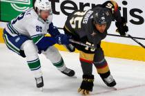 Vancouver Canucks center Jay Beagle (83) competes with Vegas Golden Knights right wing Ryan Rea ...