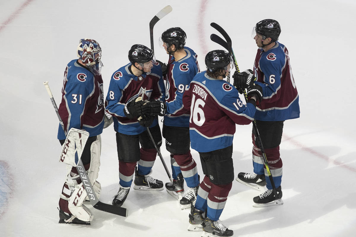 Colorado Avalanche players celebrate a win over the Arizona Coyotes in Game 5 of an NHL hockey ...