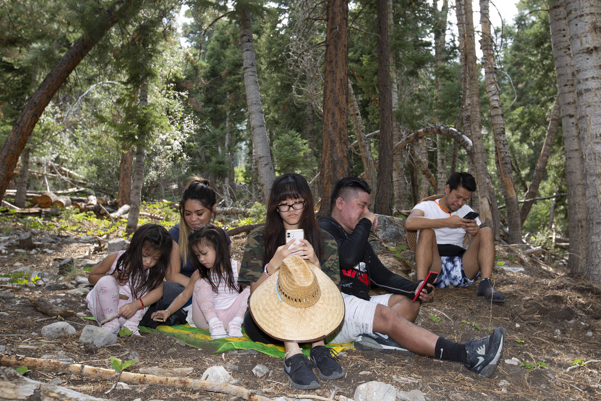 Twins Izzy Mendo and Gabby Mendo, left, 4, play with their mom Edith Mendo on Saturday, Aug. 22 ...