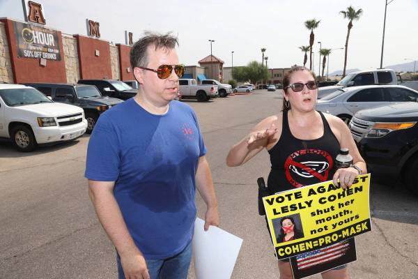 Iam Bayne, left, and Melissa Blundo, organizers for No Mask Nevada PAC, speak about their rally ...