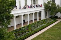 Journalists get an overhead view of the restored Rose Garden at the White House in Washington, ...