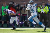 Detroit Lions running back Theo Riddick is chased by Minnesota Vikings free safety Harrison Smi ...