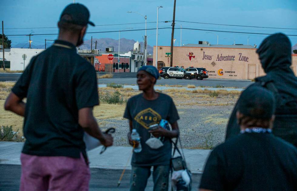 Metro police keep watchʡs New Era Las Vegas members connect with area residents while mar ...