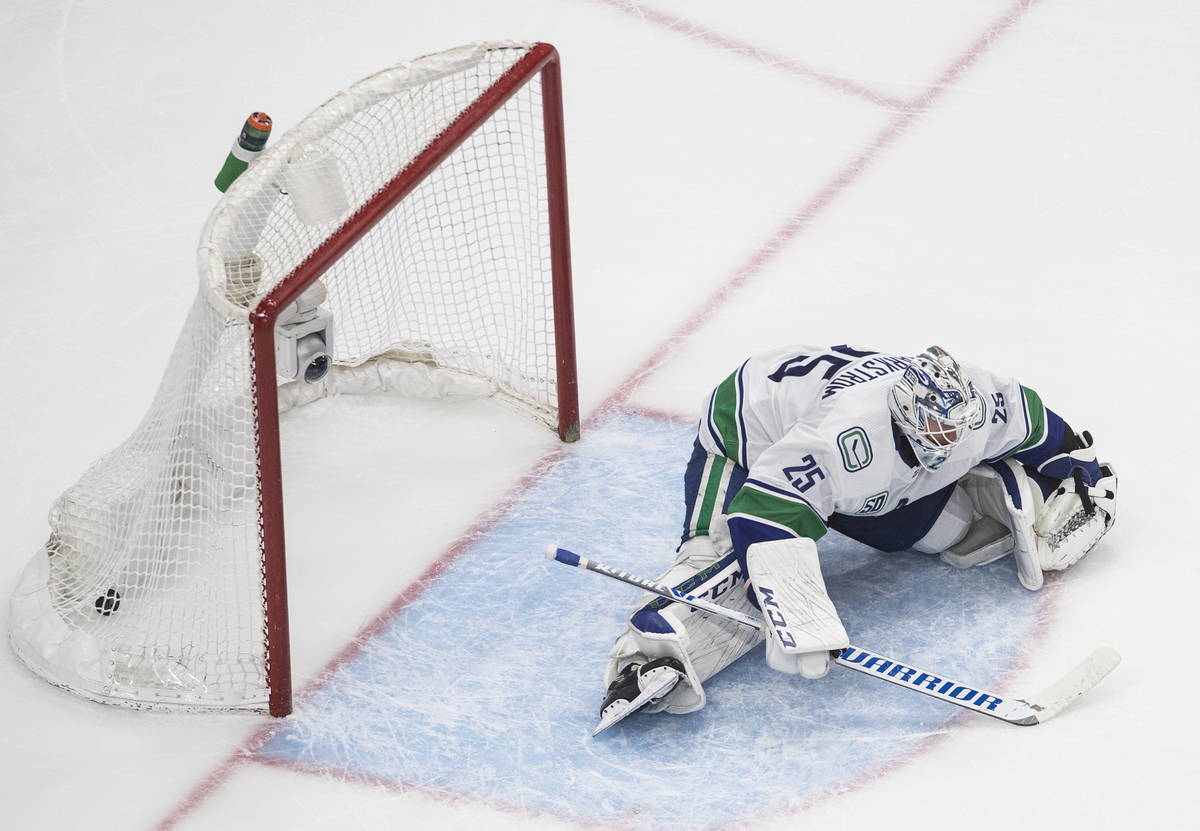 Vancouver Canucks goalie Jacob Markstrom gives up a goal to the Vegas Golden Knights during the ...