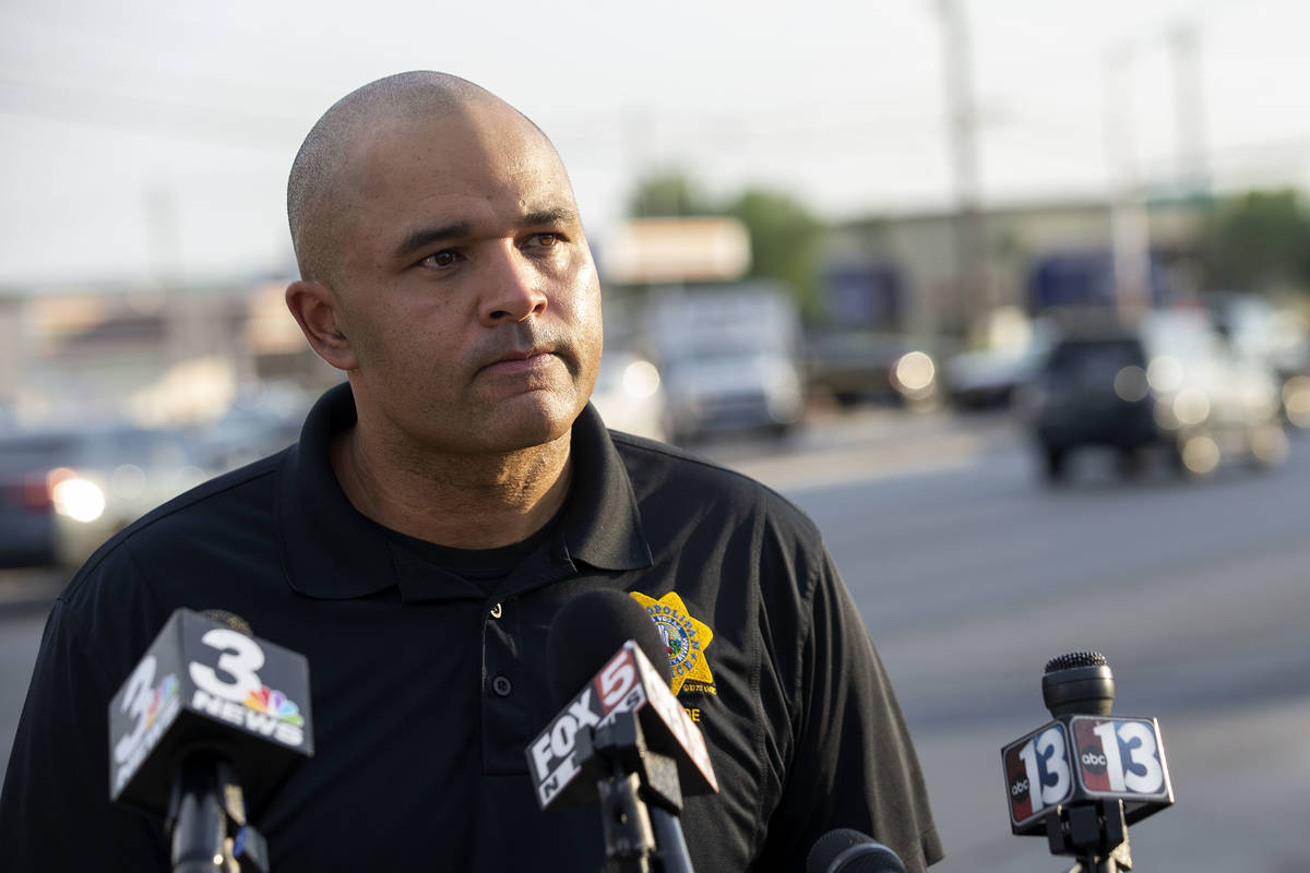 Homicide Lt. Ray Spencer gives a press briefing at the scene of a homicide near the intersectio ...