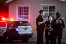 Metropolitan police investigate a homicide near the 2000 block of Palm Street, at the Riviera M ...