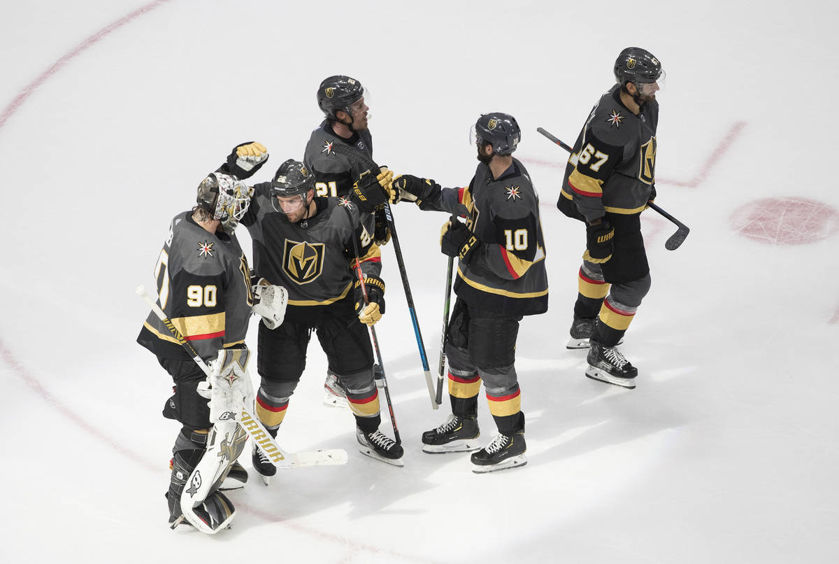 Vegas Golden Knights celebrate a win over the Vancouver Canucks in Game 1 of an NHL hockey seco ...