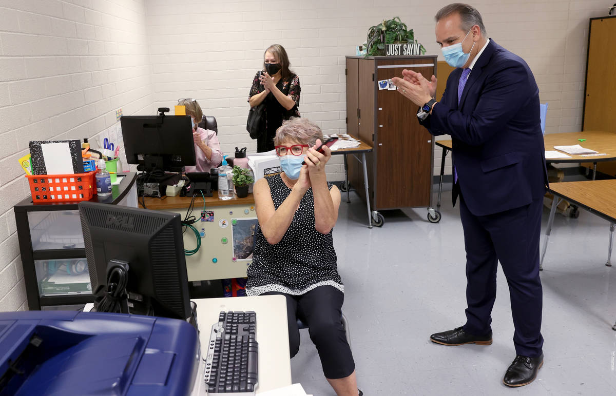 Clark County School District Superintendent Jesus Jara, right, applauds distance learning stude ...