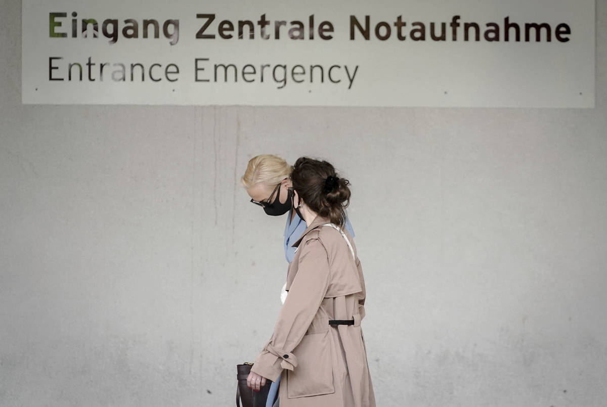 Alexei Navalny's wife Yulia, background, arrives at the Charite hospital in Berlin, Germany, Mo ...