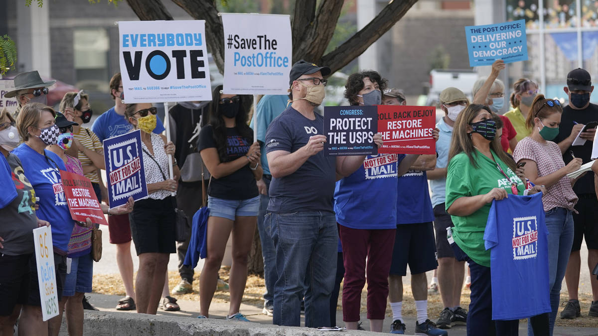 People gather during the "Save the Post Office" rally Saturday, Aug. 22, 2020, in Sal ...