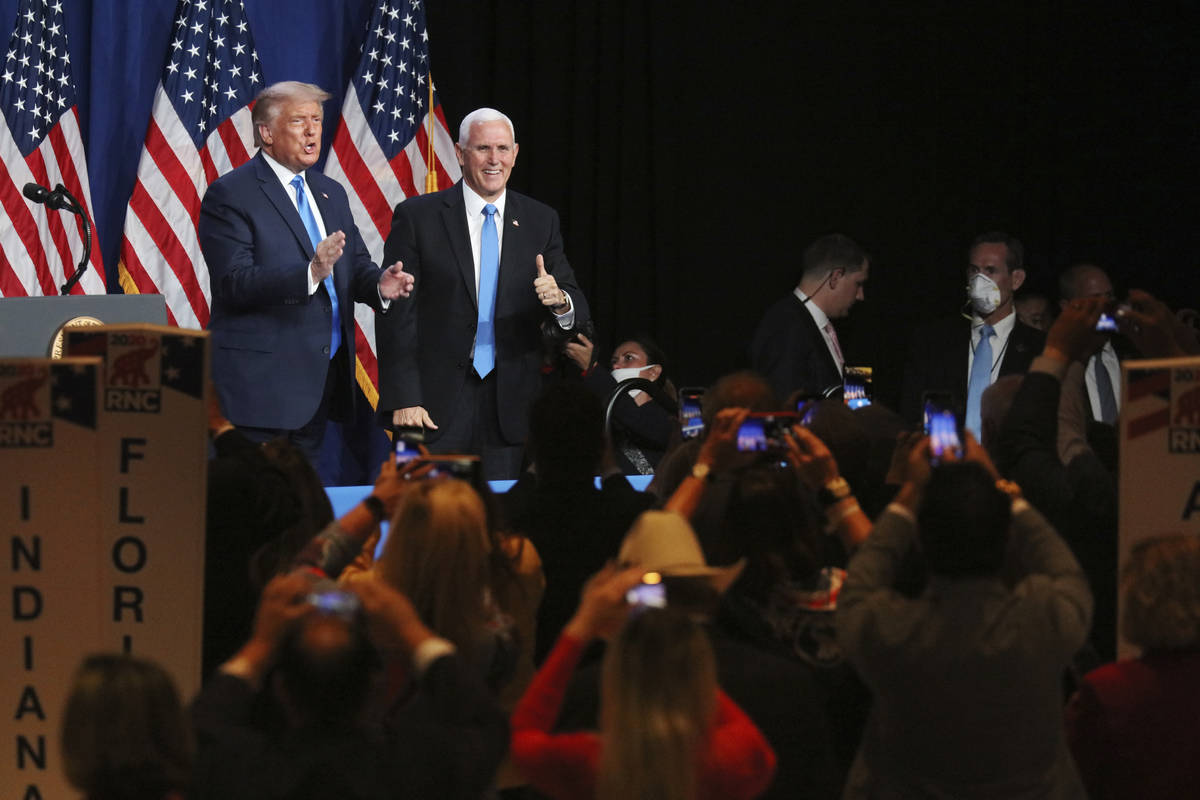 President Donald Trump and Vice President Mike Pence give a thumbs up after speaking during the ...